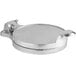 A round silver metal hamburger press with a handle.
