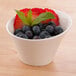 An Arcoroc Ludico deep bowl filled with blueberries and strawberries.