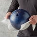 A person wiping a bowling ball with a white ChoiceHD wiper.