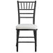 A Lancaster Table & Seating black Chiavari chair with ivory cushion.