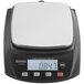 A Galaxy PC32 compact digital portion scale with a white and black design on a kitchen counter.
