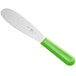 A white sandwich spreader with a neon green handle.