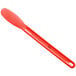 A Choice red sandwich spreader with a smooth white handle.