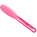 A pink plastic Choice sandwich spreader with a handle.