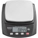 A Galaxy PC10 black and white digital portion scale on a counter.