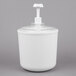 A white plastic Carlisle Coldmaster container with a pump lid.