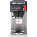 A silver and black Bloomfield automatic coffee brewer with touchpad controls on a counter.