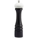 A black pepper mill with a white top.