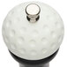 A white and black Chef Specialties 19th Hole pepper mill with a white knob on top, shaped like a golf ball.