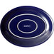 An Acopa Capri deep sea cobalt oval stoneware coupe platter in blue with white text that reads "Acopa"