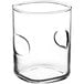 An Acopa juice glass with a thumbprint design in the middle.
