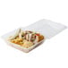 A sandwich with meat and vegetables and chips in a clear plastic GET reusable container.