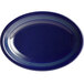 An Acopa Capri deep sea cobalt oval stoneware coupe platter with blue lines.