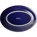 An oval deep sea cobalt blue plate with white text that reads "Acopa" on it.