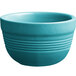 A Caribbean turquoise stoneware bouillon bowl with a handle.