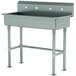 A stainless steel Advance Tabco multi-station utility sink with two faucet holes.
