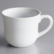 An Acopa Capri coconut white china cup with a handle.
