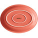An Acopa Capri coral stoneware oval platter with a white border.