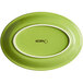 An Acopa Capri bamboo green oval stoneware coupe platter with a white rim.