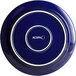 An Acopa Capri deep sea cobalt stoneware plate with white text on it.