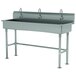 An Advance Tabco stainless steel multi-station hand sink with 3 electronic faucets.