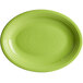 An oval green stoneware platter with a ring rim.