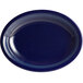 An Acopa Capri deep sea cobalt oval stoneware coupe platter with blue lines on a white background.
