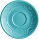 A close-up of an Acopa Capri Caribbean turquoise saucer with a circular pattern and rim.