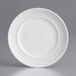 An Acopa Liana bright white porcelain plate with an embossed rim.