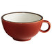An Acopa Keystone Sedona Orange stoneware coffee cup with a white rim.