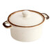 An 8 oz. vanilla bean stoneware mini casserole dish with a lid and two side handles.