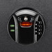 A black Barska surface-mount security safe with a black electronic lock with red light.