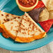 A white plate with Father Sam's Bakery Gluten-Free White Tortillas quesadillas and salsa.