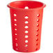 A red perforated plastic flatware holder cylinder.