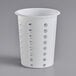 A white plastic cylinder with perforations.