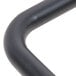 A close-up of the curved black pipe on a Aarco double pedestal poster stand.