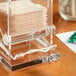 A clear plastic box with a stack of Choice unwrapped round wooden toothpicks inside.