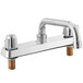 A chrome Regency deck-mount faucet with two handles and an 8" swing spout.