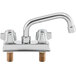 A chrome Regency deck mount faucet with two handles and a 6" swing spout.