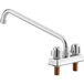 A chrome Regency deck-mount faucet with two long handles and a long silver spout.