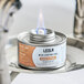 A Leola Fuel can with a flame on a table.