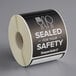 A roll of TamperSafe black paper food safety labels.