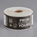 A roll of black paper Tamper-Evident labels with the words "From Our Kitchen To Yours" on it.