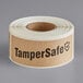 A roll of TamperSafe kraft paper labels with black text.