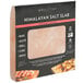 An 8" x 8" square Himalayan salt slab in a package.