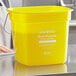 A yellow Noble Products King-Pail cleaning bucket with a yellow handle and white text.