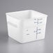A white square Carlisle food storage container with a measuring line on it.