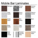 A variety of wood and granite laminate samples on the counter of a Perlick stainless steel mobile bar.