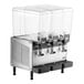 A Vollrath refrigerated beverage dispenser with three clear containers.