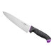 A Schraf chef knife with a purple handle and black blade on a counter.